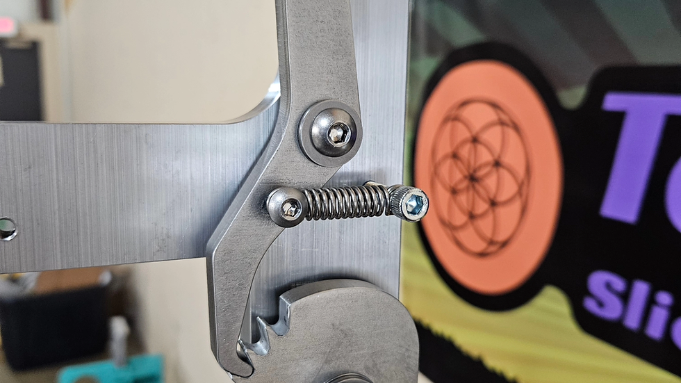 Rachet style belt tensioner with tracking wheel.  